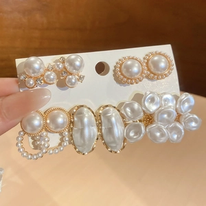 Set of four vintage pearl hair clips with gold alloy base and rhinestones