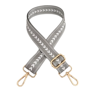 Adjustable gray nylon bag strap with white arrow pattern and gold metal hardware