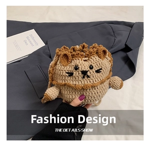 Close-up of handmade crochet lion drawstring bag showing intricate knit texture and 3D lion mane
