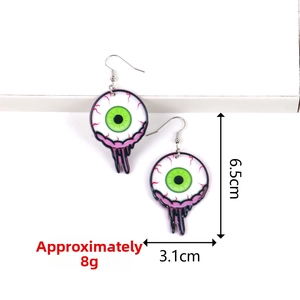 Detail showing acrylic green eyeball earring dimensions of 6.5cm length and 3.1cm width
