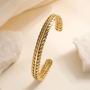Minimalist 18K gold plated wheat ear textured stainless steel open bangle on stone