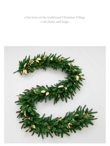 Detail of 2.7m velvet ball Christmas garland with gold leaves and warm LED lights