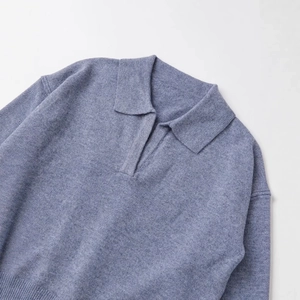 Blue-grey cashmere blend polo knit sweater featuring a minimalist v-neck collar and dropped shoulders