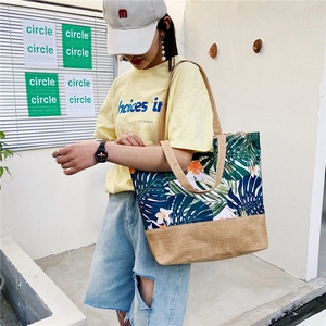 Linen tote bag with tropical leaf print and khaki burlap base for daily commuting