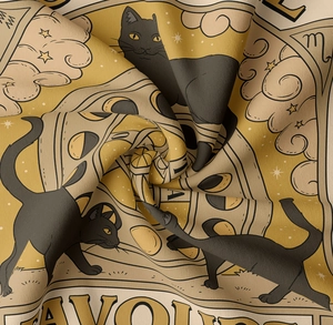 Close-up of soft fabric texture showing a vintage black cat illustration with stars