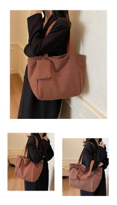 Detail view of brown woven fabric tote bag featuring textured pattern and mini pouch