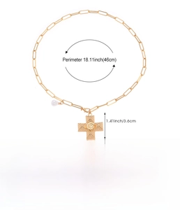 Detail showing dimensions and weight of gold cross necklace with pearl charm pendant