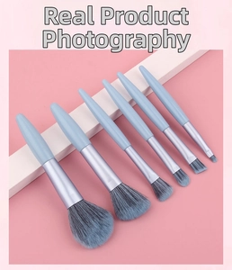 Detailed view of 6pcs professional light blue makeup brushes set on creative props