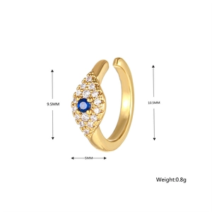 Macro detail of gold Evil Eye ear cuff with blue zircon and exact size measurements