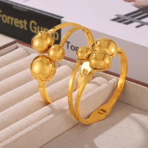 Elegant gold plated double layer spring cuff bracelet with polished metal beads display