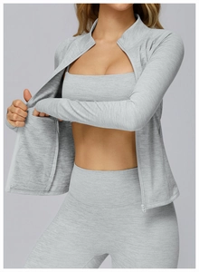 Detail of grey marl textured knit sport jacket with invisible zipper and athletic top
