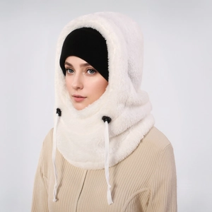 Close-up of white plush balaclava hood with black drawstrings and matching knit cap