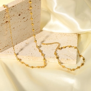 French minimalist heart pendant necklace and bracelet set in 18K gold-plated stainless steel