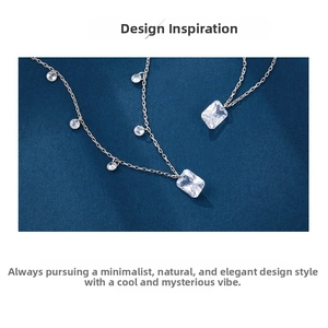 Macro shot of S925 silver necklace with rectangular zircon on textured blue background