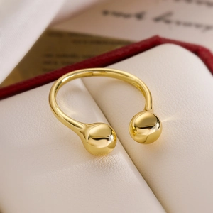 Minimalist gold-plated open ring featuring two spherical beads on a smooth metallic band