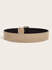 Detailed close-up of a wide khaki suede waist belt featuring a polished silver metal buckle