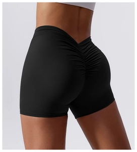 Detail view of black high-waist yoga shorts featuring a scrunch butt lifting design