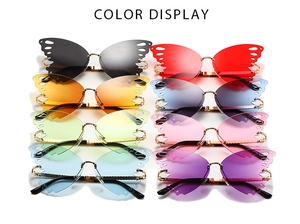 Detail showing eight color variants of butterfly-shaped rimless sunglasses with metal frames