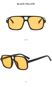 Detail view of vintage double-bridge aviator sunglasses with black frame and yellow lenses