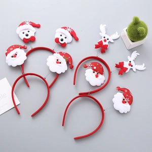 Christmas headband set featuring Santa, bear, and reindeer decorations on a flat lay background