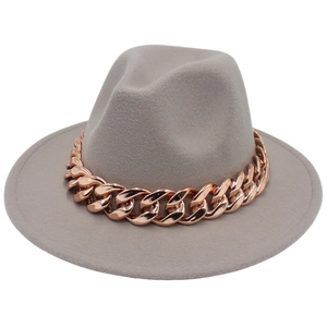 Wide brim grey fedora hat with a bold rose gold metal chain decoration on a white background