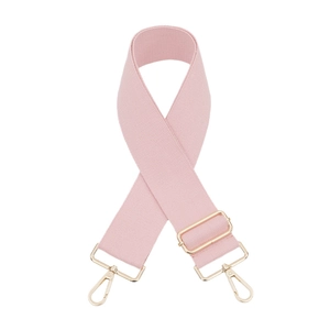 Detail of light pink canvas bag strap with pale gold metal rotating carabiner clips