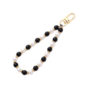 Handmade beaded phone strap with black and white gemstones and gold decorative accents