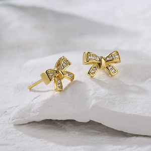 Elegant gold bow earrings with sparkling micro-pave zircons for women