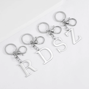 Polished silver stainless steel alphabet keychains showing R, D, S, Z letter charms