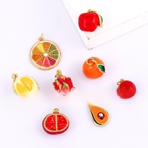 Detailed view of colorful fruit pendants like apple and orange for DIY jewelry making
