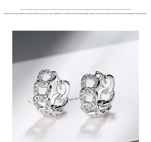 Macro shot of S925 sterling silver chain earrings with pavé set white cubic zirconia