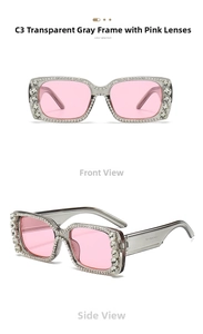 Close-up of oversized square sunglasses with crystal-studded grey frame and pink lenses