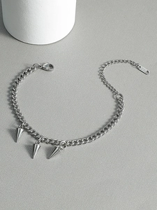 Detail of 316L stainless steel chain bracelet with punk spike charms and lobster clasp
