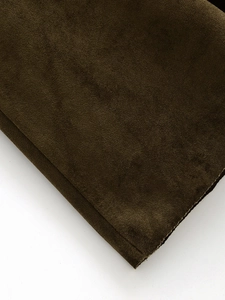 Detailed macro view of olive green faux suede fabric with thick texture and clean edges