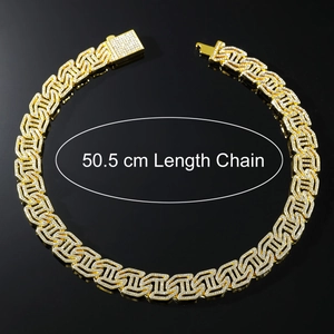Close-up of a 50.5 cm gold-plated Cuban chain necklace with iced-out diamond H letters