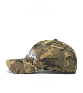 Detail of vintage washed camouflage baseball cap with 3D embroidery and distressed brim