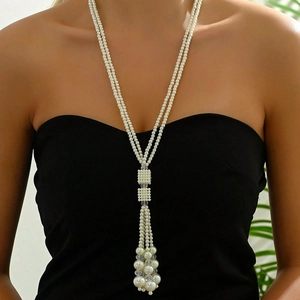 Elegant multi-layer long pearl necklace with tassel pendant and square woven bead buckle