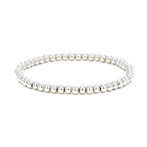 Polished silver metal bead bracelet laid flat on a white background with modern minimalist style