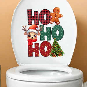 Close-up of Christmas gingerbread man and reindeer decals on a white toilet lid