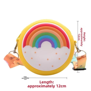 Detail view of 12cm silicone donut rainbow purse with adjustable gradient strap