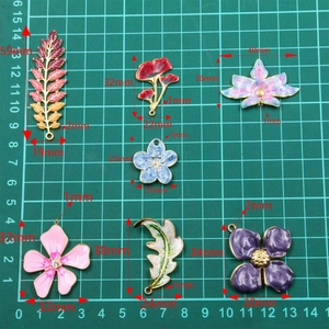 Detailed dimensions of colorful enamel flower and leaf charms for DIY jewelry making
