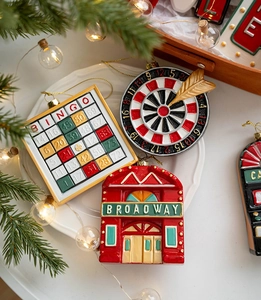 Close-up of vintage Christmas ornaments featuring Bingo and Broadway theatre designs