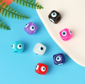 Detailed view of colorful square resin evil eye beads for handmade jewelry DIY projects