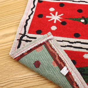 Close-up of Christmas placemat showing polyester cotton blend fabric and care label