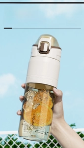 Macro detail of a BPA-free brown PPSU water bottle with lock lid and silicone grip
