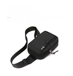 Detail view of water-resistant black nylon chest bag with premium smooth zippers