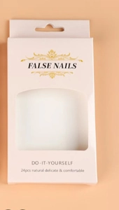 Detail view of 24pcs false nails packaging with transparent window and gold text
