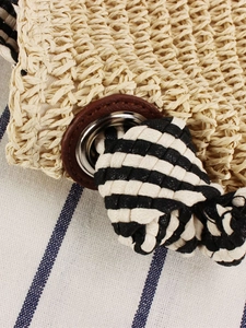 Handwoven paper rope beach bag with black-white striped nautical knot strap and leather detail