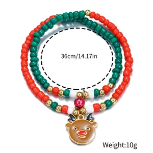Christmas beaded bracelet with red, green, white beads and a brown reindeer charm