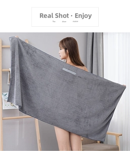 Detail of gray coral fleece hair towel with soft waffle texture and elastic band